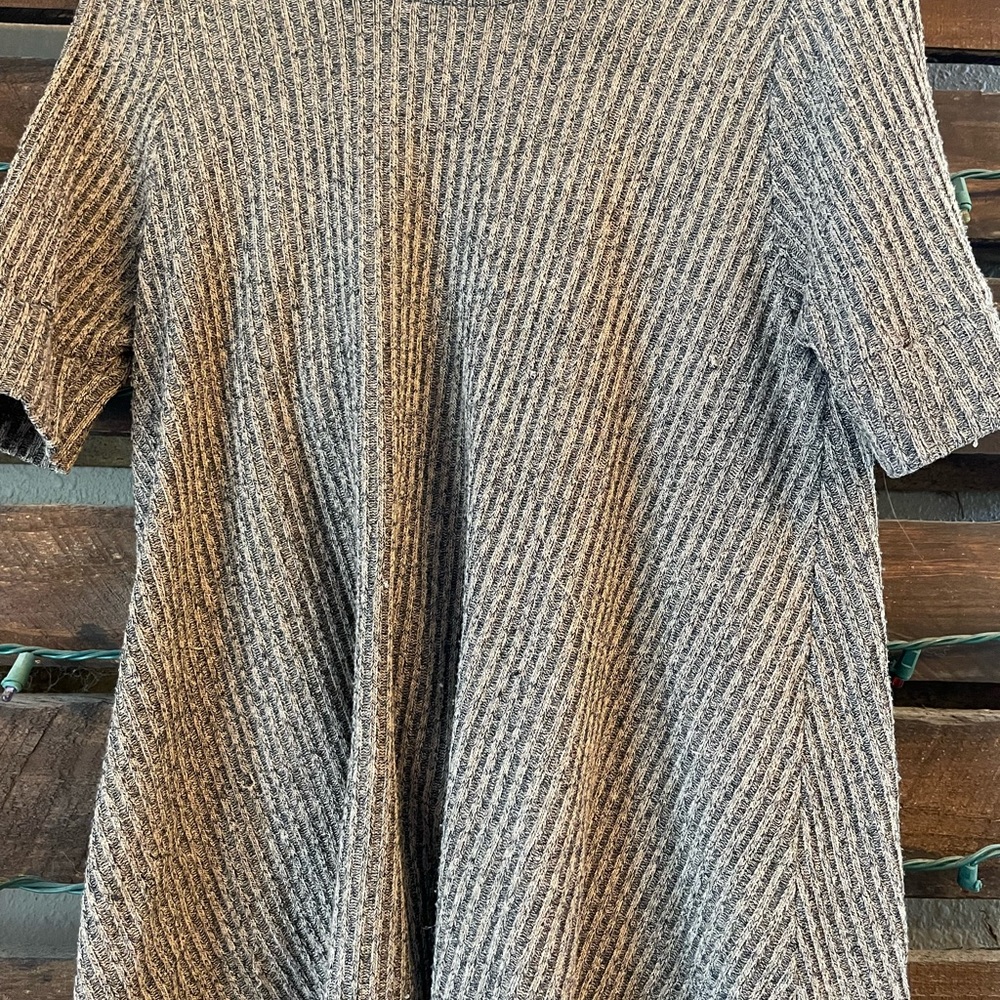 Brown flowy high-neck top.